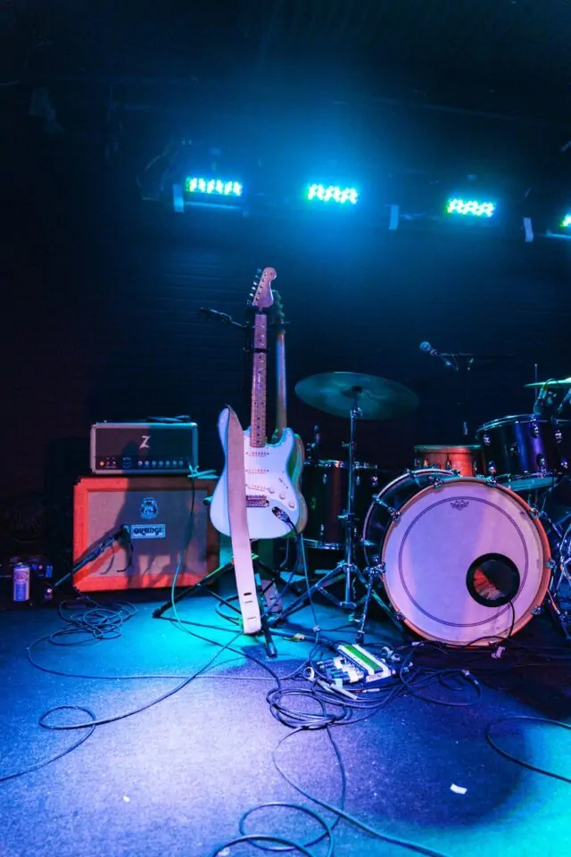 photo of electric guitar and drum set