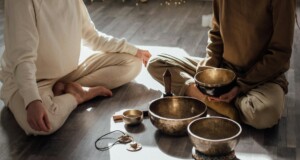 women sitting on floor doing meditation and relaxation