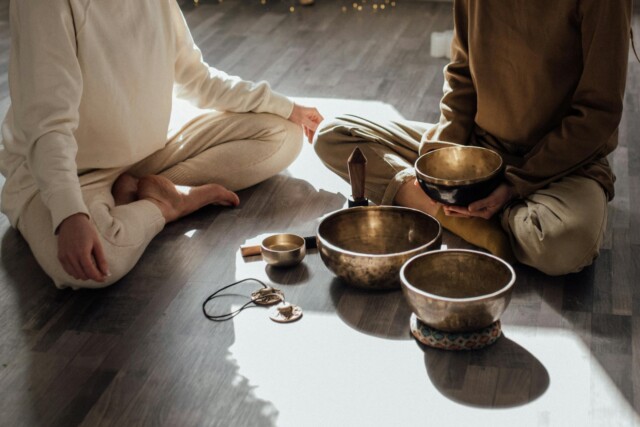 women sitting on floor doing meditation and relaxation