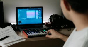 a person playing keyboard synthesizer