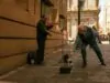 man playing violin on a street