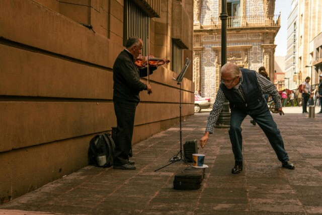 pexels-photo-26920675 man playing violin on a street