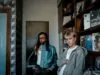 trendy young men in urban record store setting